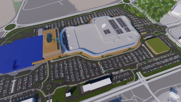 Översiktsbild på den föreslagna till- och påbyggnaden, sett från norr. Ikea ligger i bildens vänstra del markerat i blått, utanför planområdet. Planförslaget medger en överbyggnad till Ikea. (illustration: Möller arkitekter)