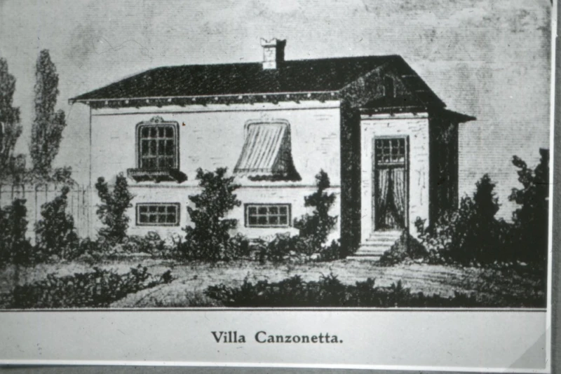 Svartvitt tryck av hus. 
