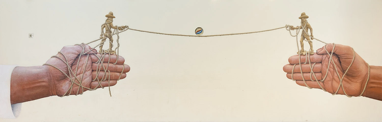 Illusionsmålning på vägg med två cowboys som balanserar en glaskula på ett rep.