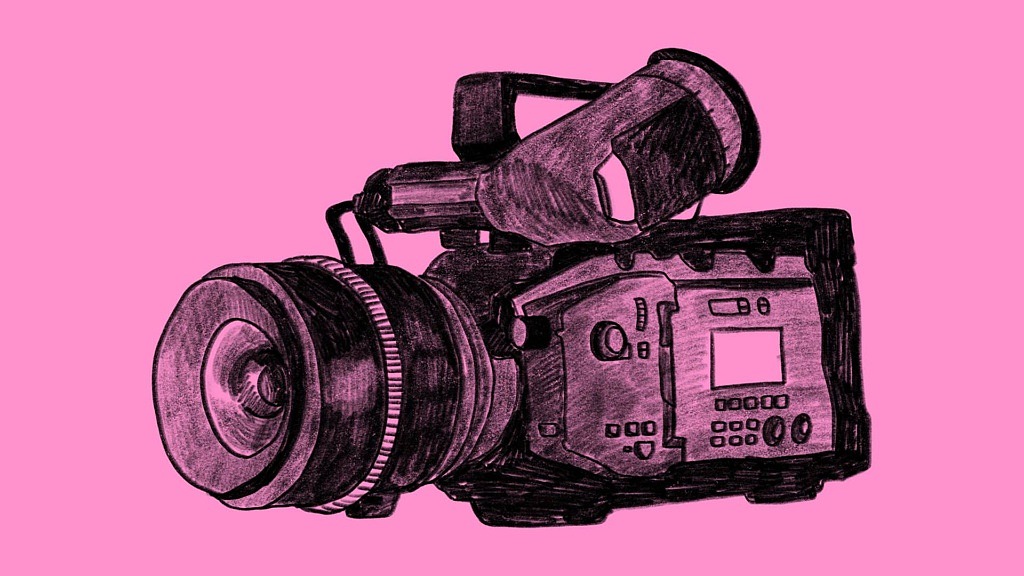 Filmkamera på rosa bakgrund